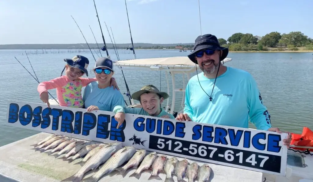 a family fishing with Bosstriper guide services at lake Buchanan